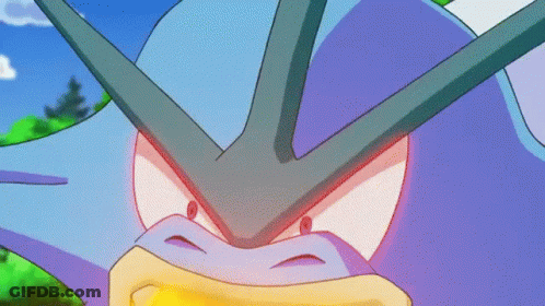 A Close Up Of A Purple And Blue Cartoon Character With A Red Eye GIF