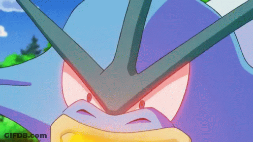 A Close Up Of A Purple And Blue Cartoon Character With Red Eyes GIF