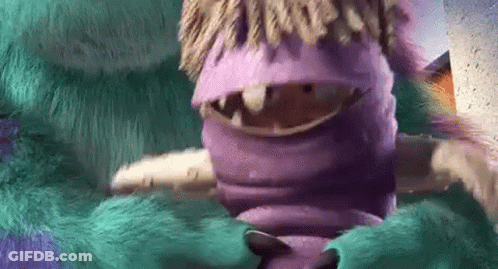 A Close Up Of A Purple And Green Monster From Monsters Inc GIF