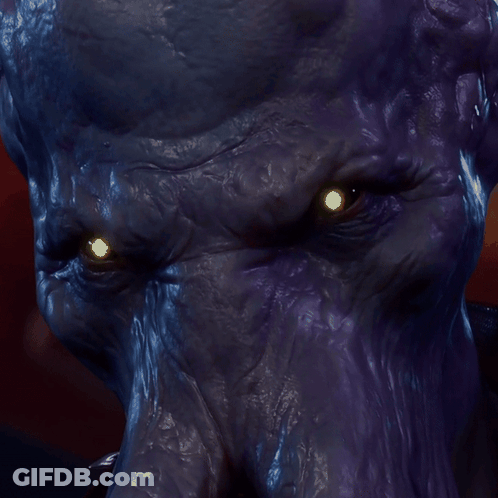 A Close Up Of A Purple Monster 'S Face With Glowing Eyes GIF