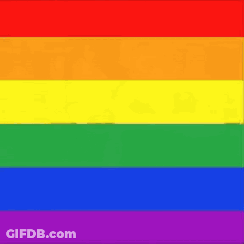 A Close Up Of A Rainbow Flag With A Blurred Image Of A Person In The Background . GIF
