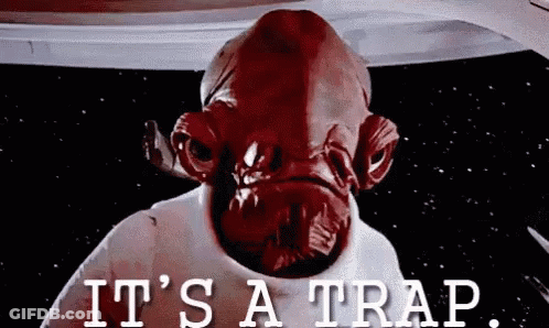 A Close Up Of A Red Alien With The Words `` It 'S A Trap '' Written On The Bottom . GIF