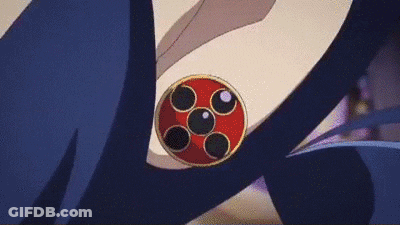 A Close Up Of A Red And Black Circle On A Person 'S Shoulder . GIF