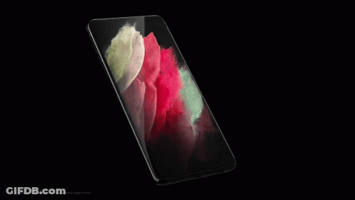 A Close Up Of A Red And Green Colored Surface On A Black Background GIF