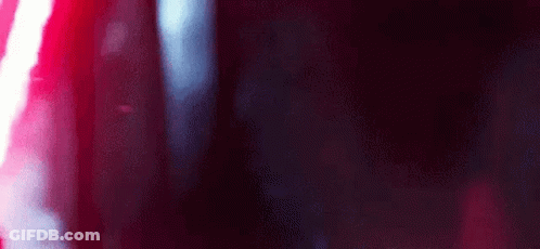 A Close Up Of A Red And White Light On A Black Background . GIF