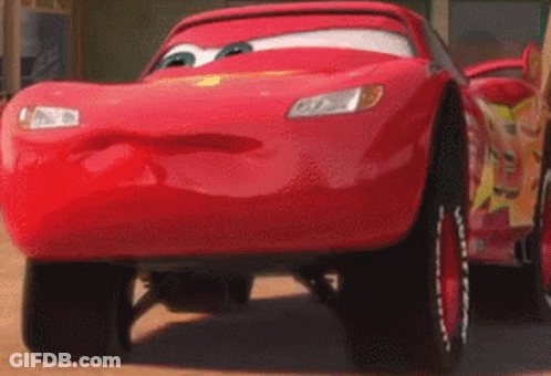 A Close Up Of A Red Car With A Face On It GIF