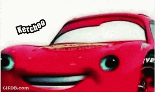 A Close Up Of A Red Car With A Smiling Face And The Words Kerchoo On It . GIF