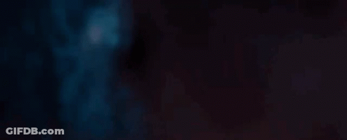 A Close Up Of A Red Light Beam On A Dark Background . GIF