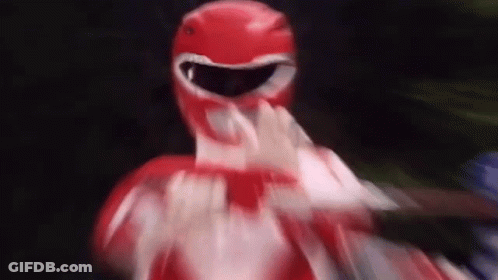 A Close Up Of A Red Power Ranger Making A Funny Face . GIF