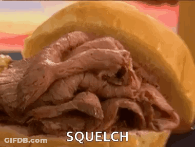 A Close Up Of A Roast Beef Sandwich On A Bun With The Word Squelch Written On It . GIF