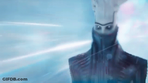 A Close Up Of A Robot 'S Face With A Blue Background And A Light Coming Out Of It . GIF