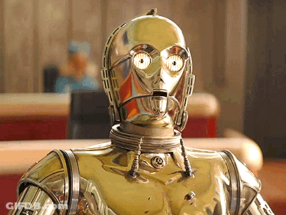 A Close Up Of A Robot 'S Face With A Reflection Of A Man In The Background GIF