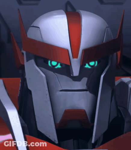 A Close Up Of A Robot 'S Face With Blue Eyes GIF