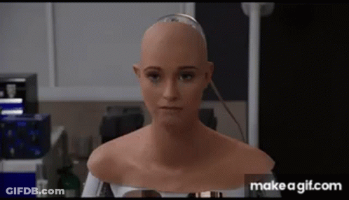 A Close Up Of A Robot 'S Head With A Bald Head And A Shaved Head . GIF