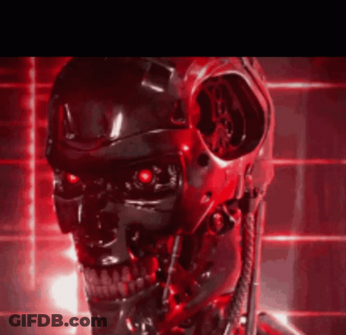 A Close Up Of A Robot 'S Head With Red Lights Behind It GIF