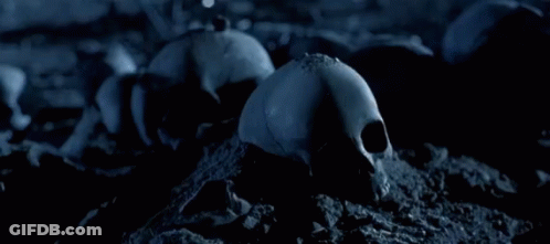 A Close Up Of A Robot With A Gun And A Flame In The Background GIF