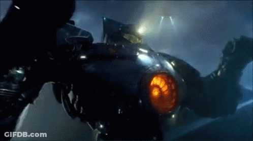 A Close Up Of A Robot With A Red Light Coming Out Of It 'S Mouth . GIF