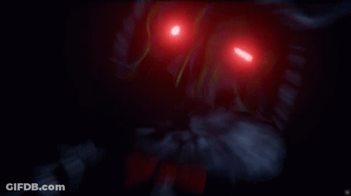 A Close Up Of A Robot With Bright Red Eyes GIF
