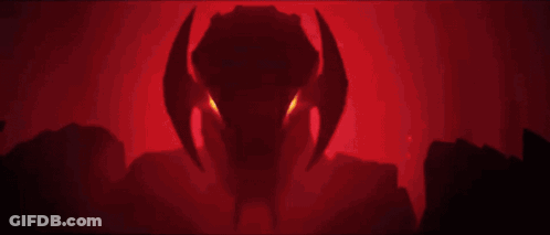 A Close Up Of A Robot With Red Eyes And Horns . GIF