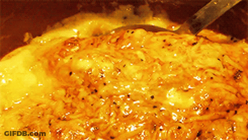 A Close Up Of A Sauce With A Spoon GIF