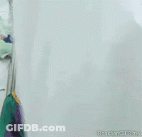 A Close Up Of A Scary Clown With A Red Hat GIF