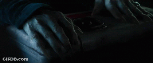A Close Up Of A Scary Face With Red Eyes GIF