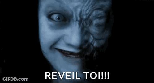 A Close Up Of A Scary Face With The Words `` Reveal To ! '' GIF