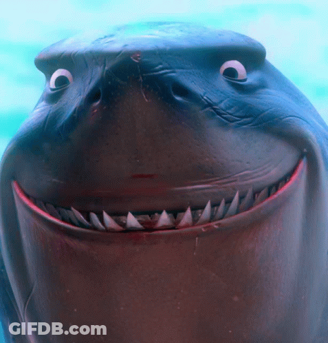 A Close Up Of A Shark 'S Face With Big Eyes And Sharp Teeth GIF