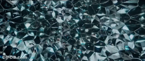 A Close Up Of A Shiny Blue Glass Texture GIF