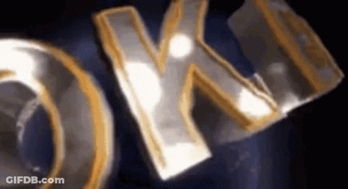 A Close Up Of A Sign That Says Ok On It On A Black Background . GIF