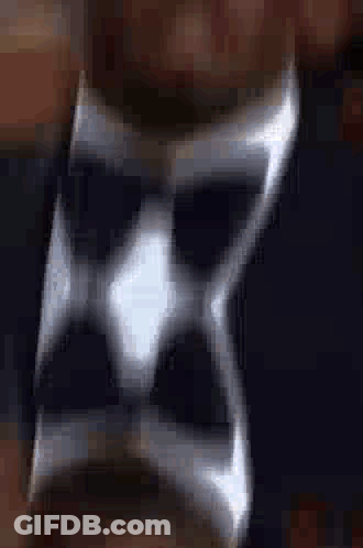 A Close Up Of A Silver Ring On A Man 'S Finger . GIF