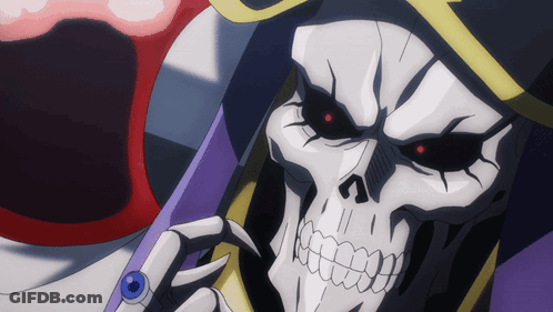 A Close Up Of A Skeleton With Red Eyes And A Ring On His Finger GIF