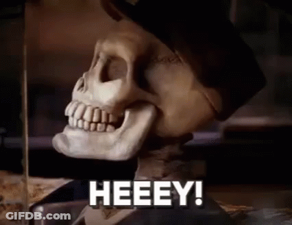 A Close Up Of A Skeleton With The Words Heeey In Front Of It . GIF