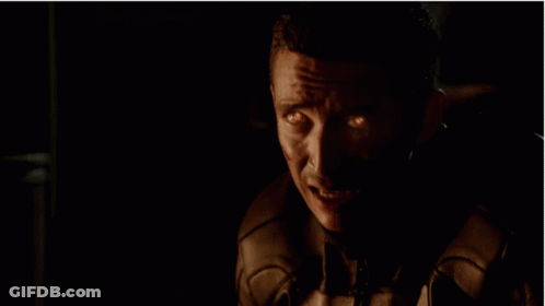 A Close Up Of A Skull With Flames Coming Out Of It GIF