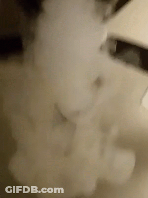 A Close Up Of A Smoke Coming Out Of A Pipe GIF