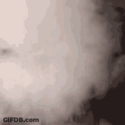 A Close Up Of A Smoke Coming Out Of A Window GIF