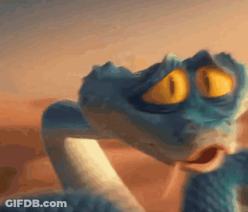A Close Up Of A Snake With Yellow Eyes GIF