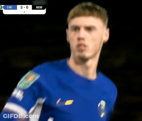A Close Up Of A Soccer Player 'S Face With A Scoreboard In The Background That Says Che 0-0 New GIF