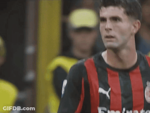 A Close Up Of A Soccer Player Wearing A Red And Black Jersey That Says Fly Emirates On It GIF