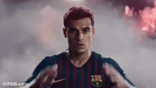 A Close Up Of A Soccer Player Wearing A Striped Jersey GIF
