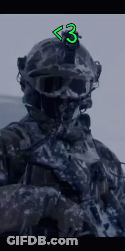 Close Up Of Soldier's Face With Number 3 Helmet GIF