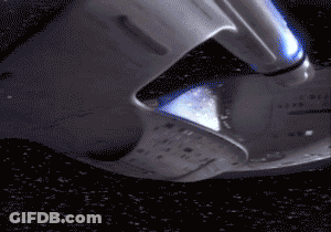 A Close Up Of A Space Ship With A Blue Light Coming Out Of The Bottom GIF