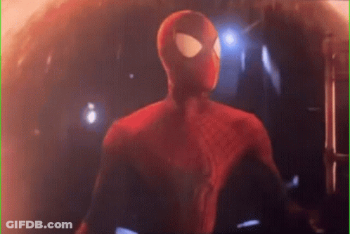 A Close Up Of A Spider-Man In A Red Suit Standing In A Dark Room . GIF