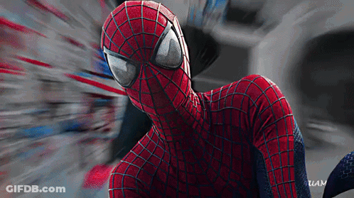A Close Up Of A Spider Man 'S Face With A Blurred Background And The Word Uan On The Bottom GIF