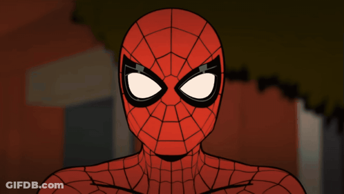 A Close Up Of A Spider Man 'S Face With A Brick Wall In The Background GIF
