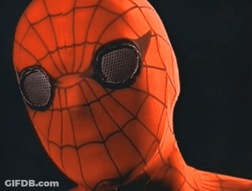 A Close Up Of A Spider Man 'S Face With Black Eyes GIF