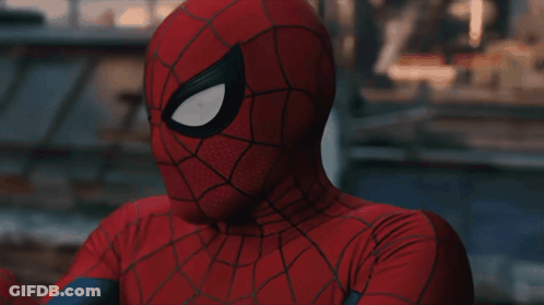 A Close Up Of A Spider Man 'S Face With His Eyes Closed GIF