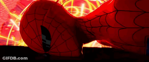 A Close Up Of A Spider Man 'S Head With A Spider Web Behind Him . GIF