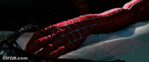 A Close Up Of A Spider Man 'S Leg With Spider Webs Coming Out Of It GIF