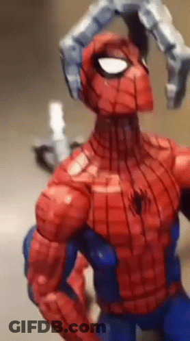 A Close Up Of A Spiderman Action Figure With A Robotic Arm GIF